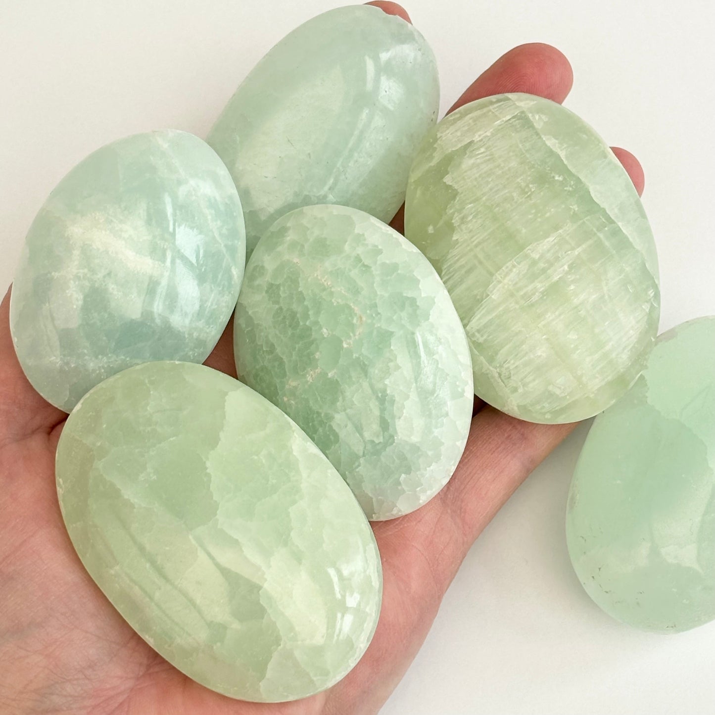 Pistachio Calcite Palmstones from UK Wholesale Crystals